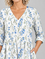 Lenora long blouse in white with cornflower blue wildflower print, close up of print and neckline