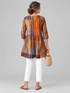Amaia long blouse in burnt orange and violet painted stripe print, back view