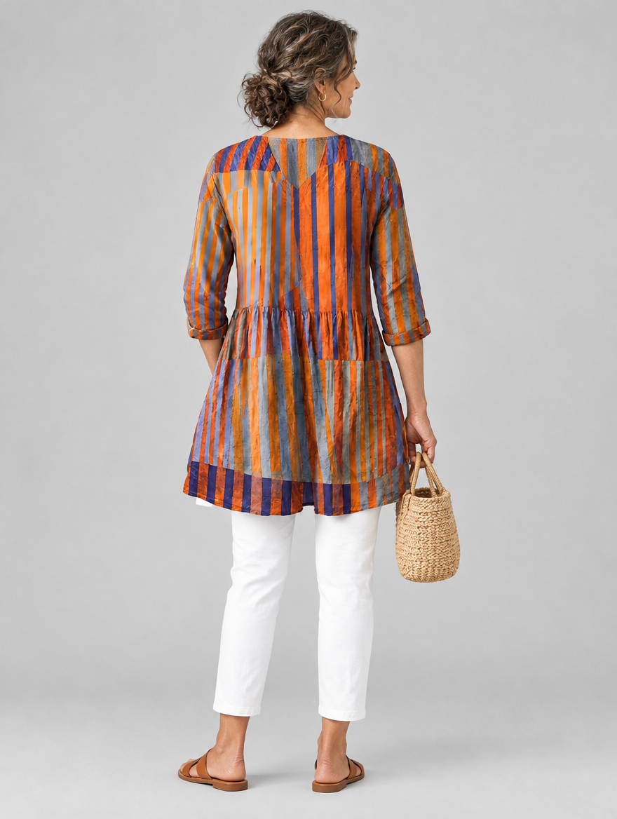 Amaia long blouse in burnt orange and violet painted stripe print, back view