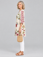 Lottie long blouse in beige folk floral print, side view showing the relaxed fit