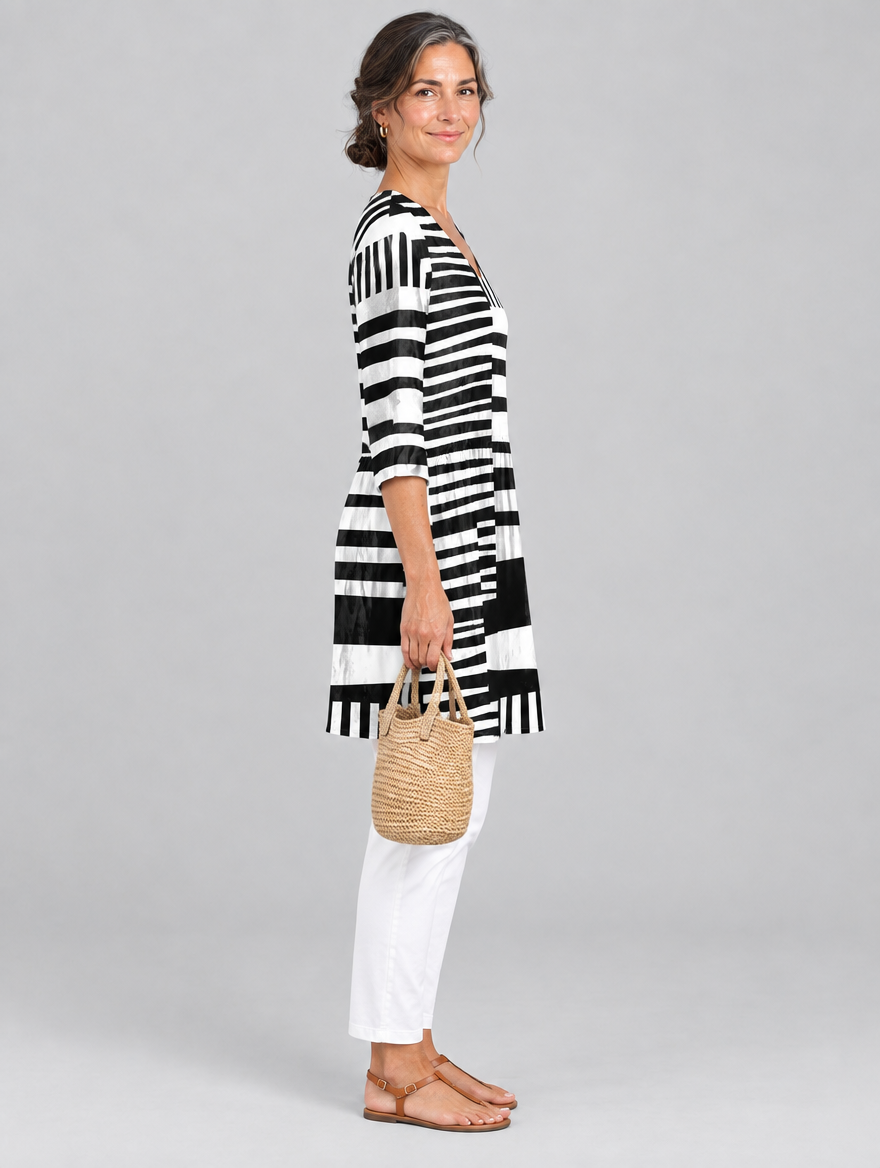 Sienna long blouse in black and white block stripe print, side view showing the relaxed fit