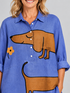 Anne relaxed tunic in periwinkle blue sausage dog print, close up of print and collar
