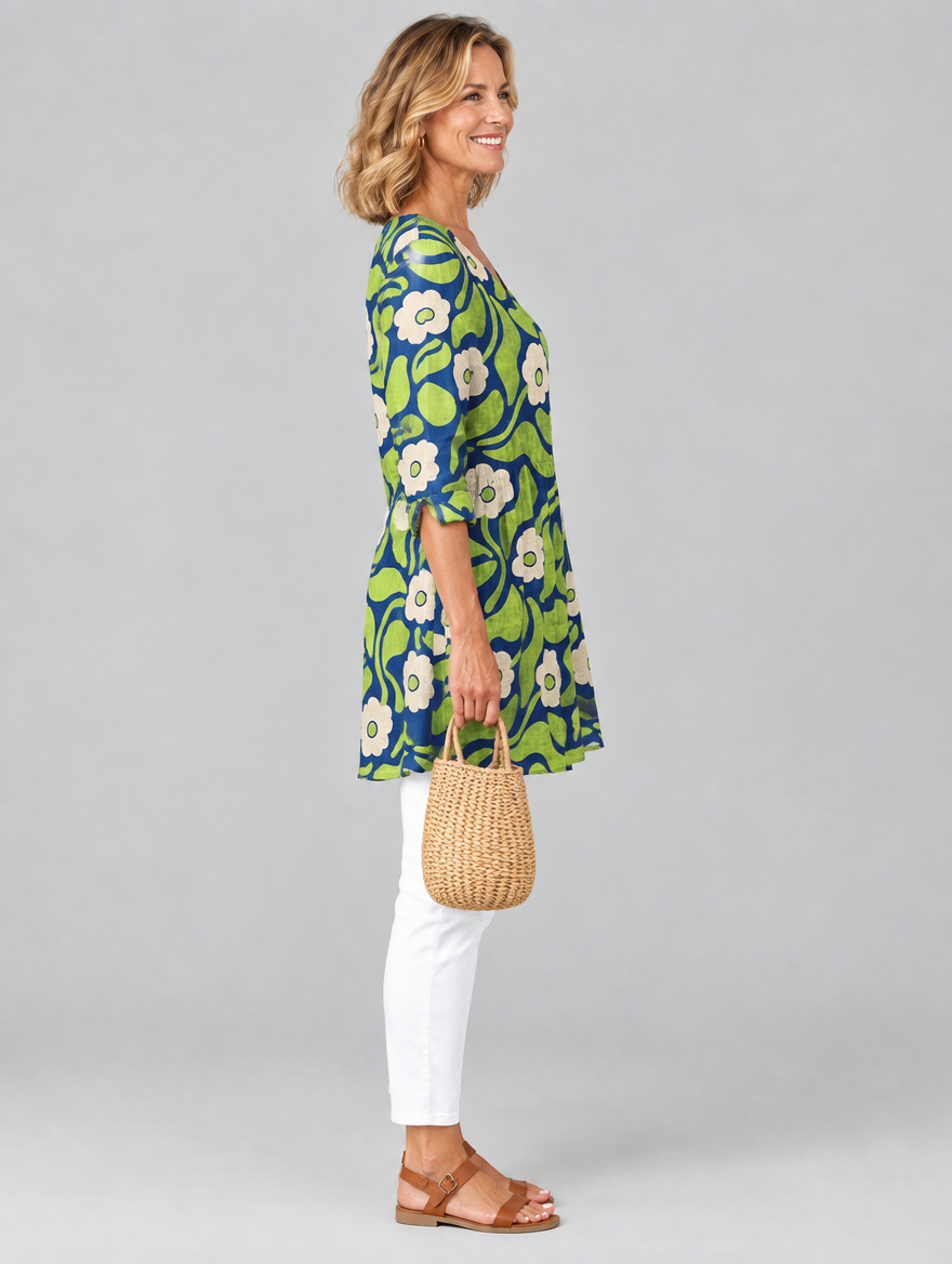 Stephanie long blouse in navy and lime retro daisy print, side view showing the relaxed fit