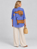 Anne relaxed tunic in periwinkle blue sausage dog print, back view