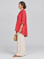 Coleen relaxed tunic in coral red, side view showing the relaxed fit