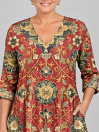 Amoura long blouse in brick red medallion tapestry print, close up of print and neckline