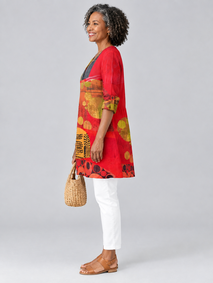 Maria long blouse in tomato red art collage print, side view showing the relaxed fit