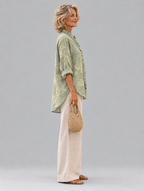 Mabel relaxed tunic in sage green tonal peony print, side view showing the relaxed fit