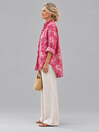 Flora relaxed tunic in raspberry pink rose print, side view showing the relaxed fit
