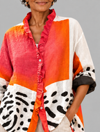Kinsley relaxed tunic close up of print and ruffle neckline