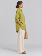 Denise relaxed linen tunic in olive yellow, side view showing the relaxed fit