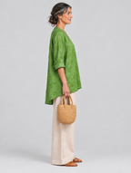 Deborah relaxed tunic in apple green, side view showing the relaxed fit