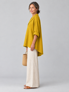 Lilah relaxed tunic in mustard yellow, side view showing the relaxed fit