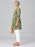 Everly long blouse in sage green botanical print, side view showing the relaxed fit