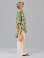 Patricia relaxed tunic in sage peacock and poppy print, side view showing the relaxed fit