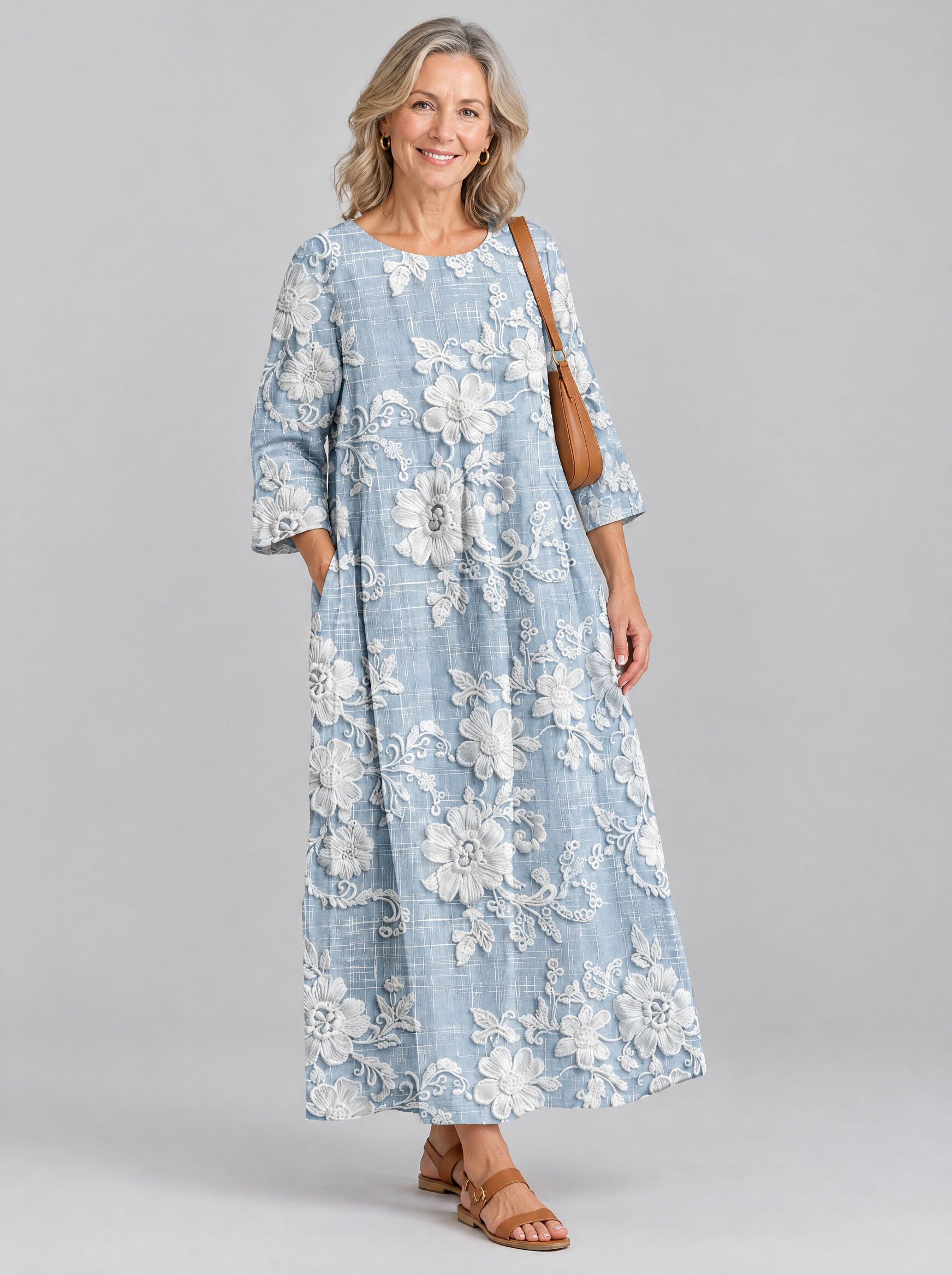 Avery printed maxi dress in blue with raised white floral print, front view