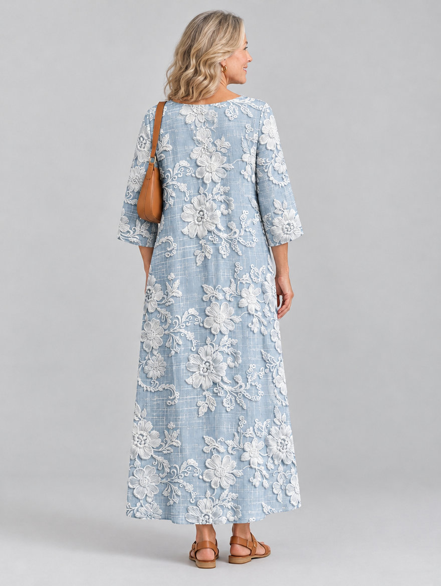 Avery printed maxi dress in blue with raised white floral print, back view
