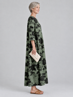 Scarlett printed maxi dress in sage green with black floral print, side view
