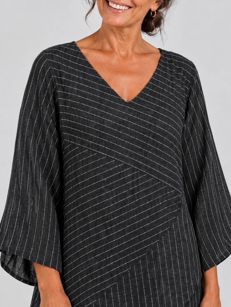 Ella pinstripe tunic top in black, close up of print and neckline