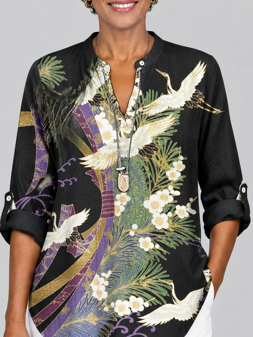 Penelope printed shirt in black with crane and blossom print, close up of print and neckline