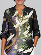 Penelope printed shirt in black with crane and blossom print, close up of print and neckline