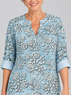 Aria printed tunic top in light blue with embossed rose print, close up of print and neckline