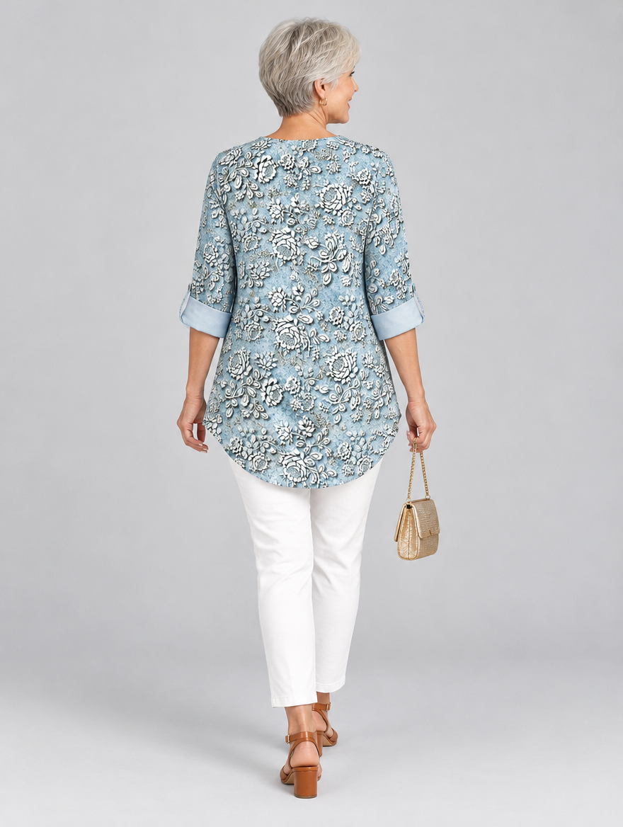 Aria printed tunic top in light blue with embossed rose print, back view