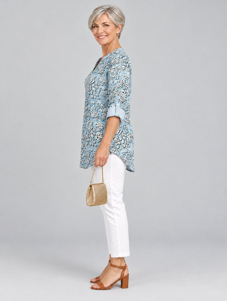 Aria printed tunic top in light blue with embossed rose print, side view