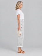 Inaya button trousers in white stripe, side view