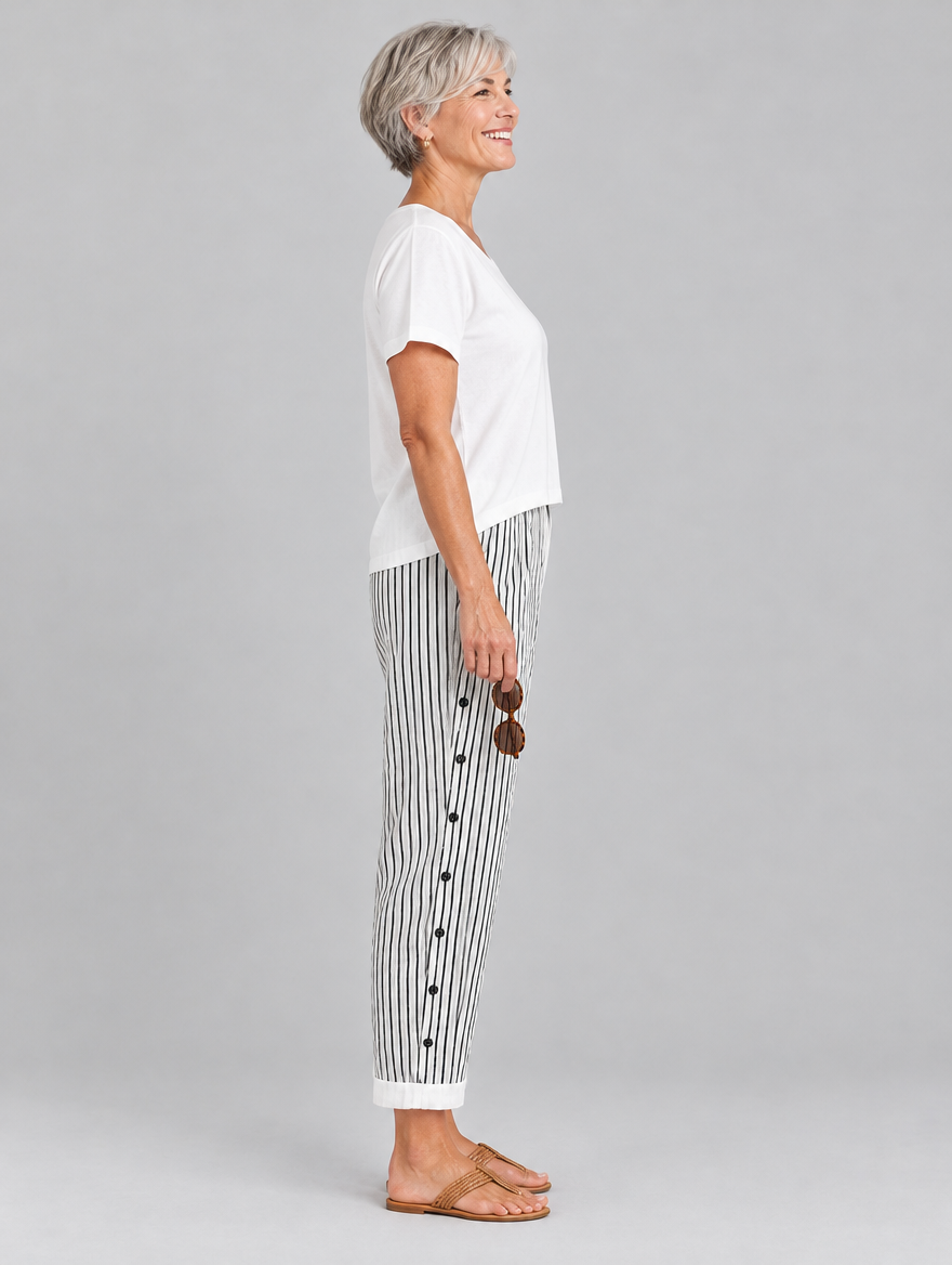 Megan button trousers in black pinstripe, side view