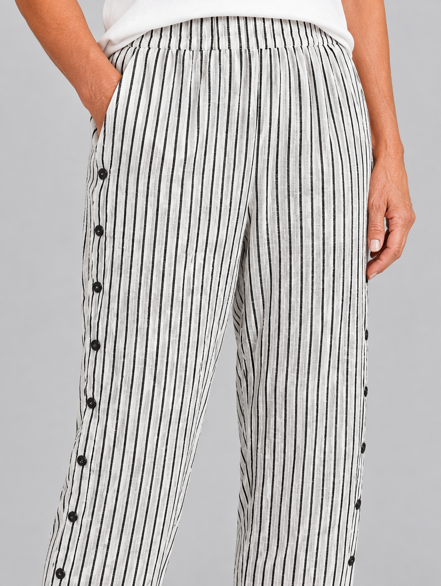 Megan button trousers in black pinstripe, close up of waistband, side buttons and fabric