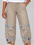 Everlee floral comfort pants in khaki, close up of flower print and tulip hem