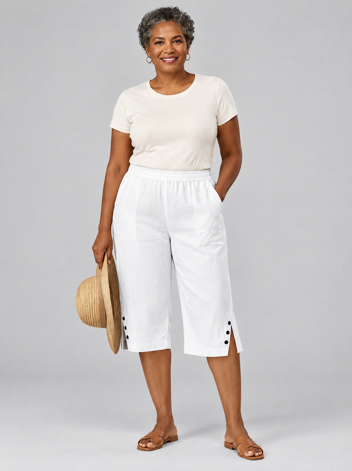 Laurel lightweight comfort shorts in white with button side slits, front view
