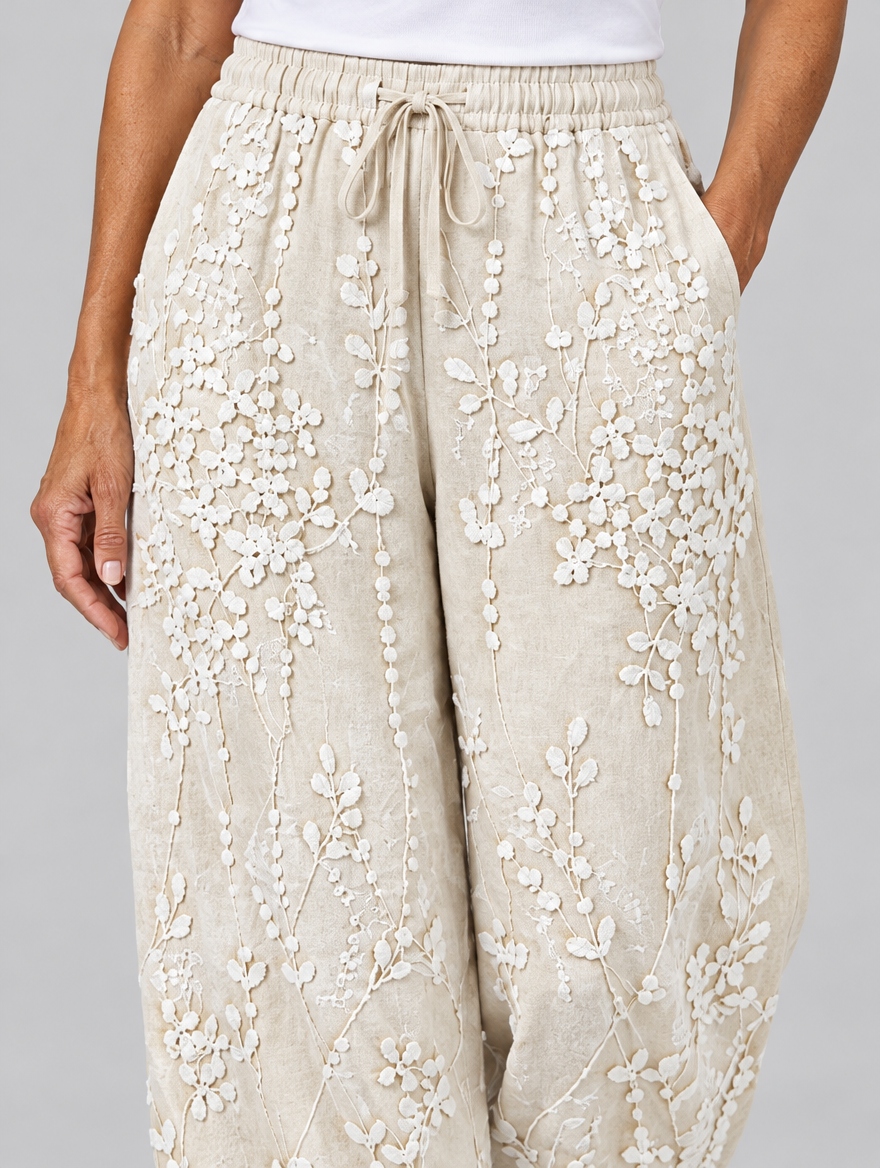Eleanor vine printed trousers in beige, close up of waistband and fabric