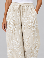 Eleanor vine printed trousers in beige, close up of waistband and fabric