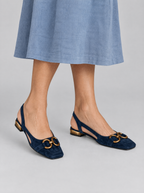 Brenna sandals in navy blue, worn with a dusty blue linen skirt