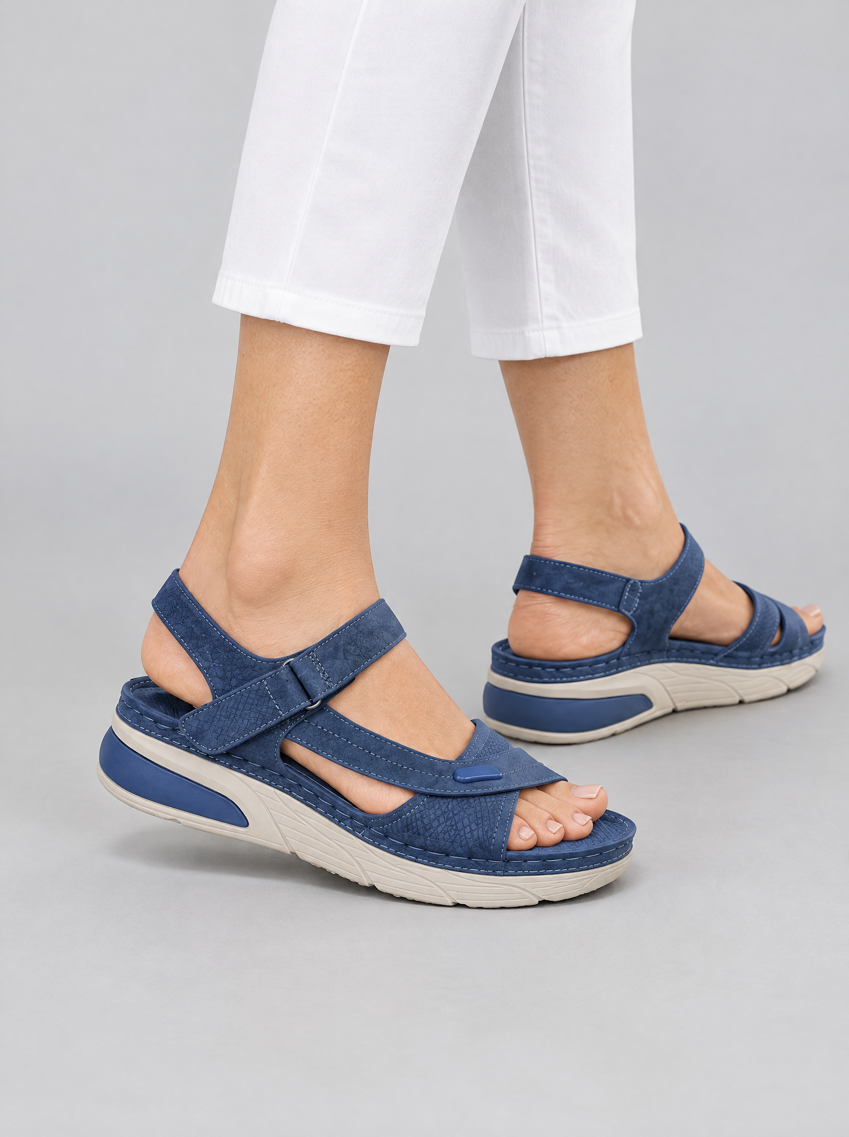 Helga sandals in blue, worn with white cropped trousers