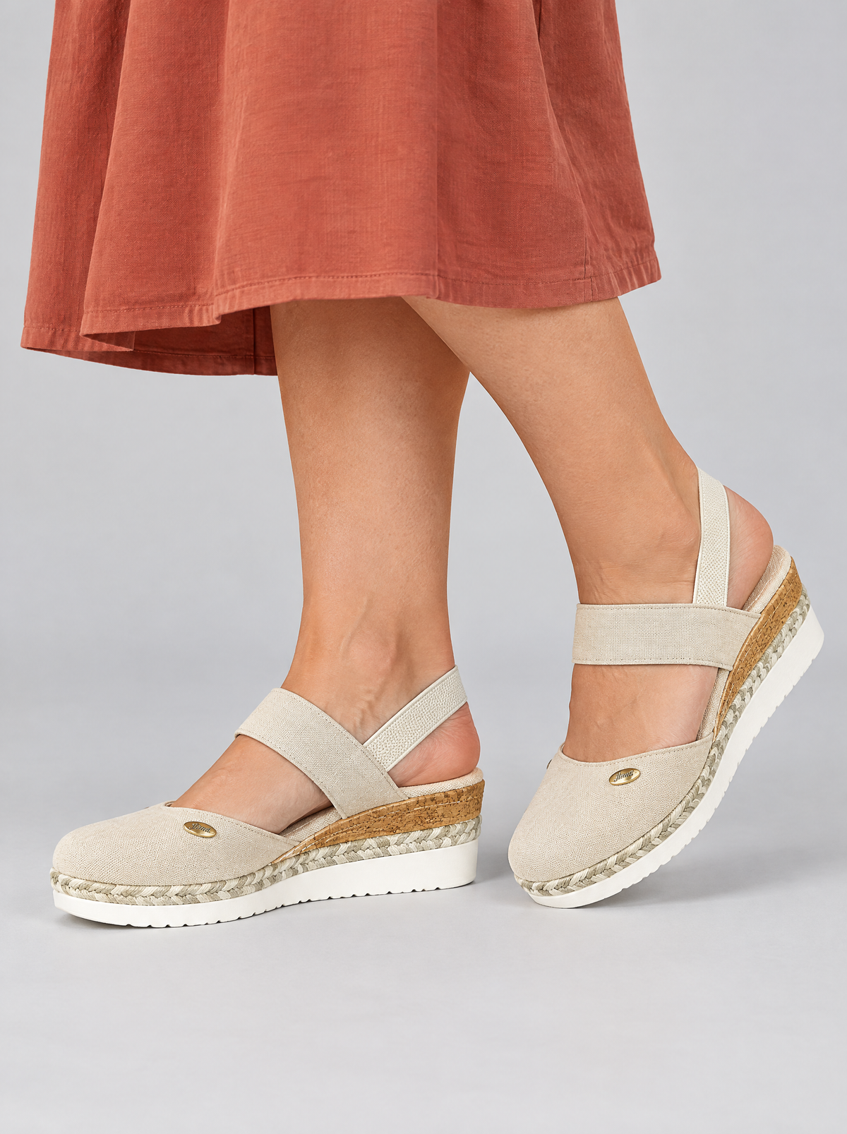 Brenda sandals in white, worn with a terracotta cotton dress