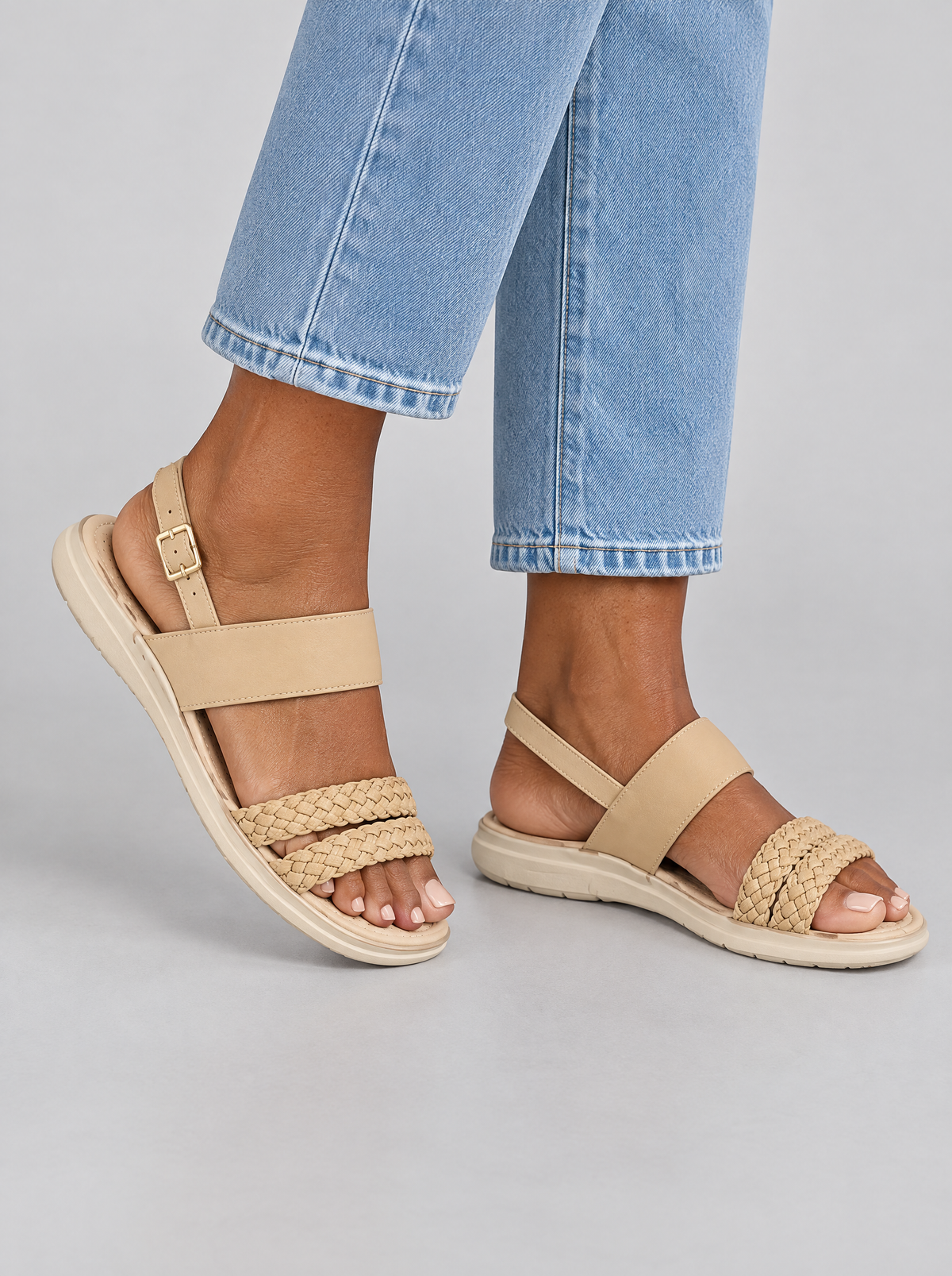 Agnes sandals in beige, worn with light blue jeans