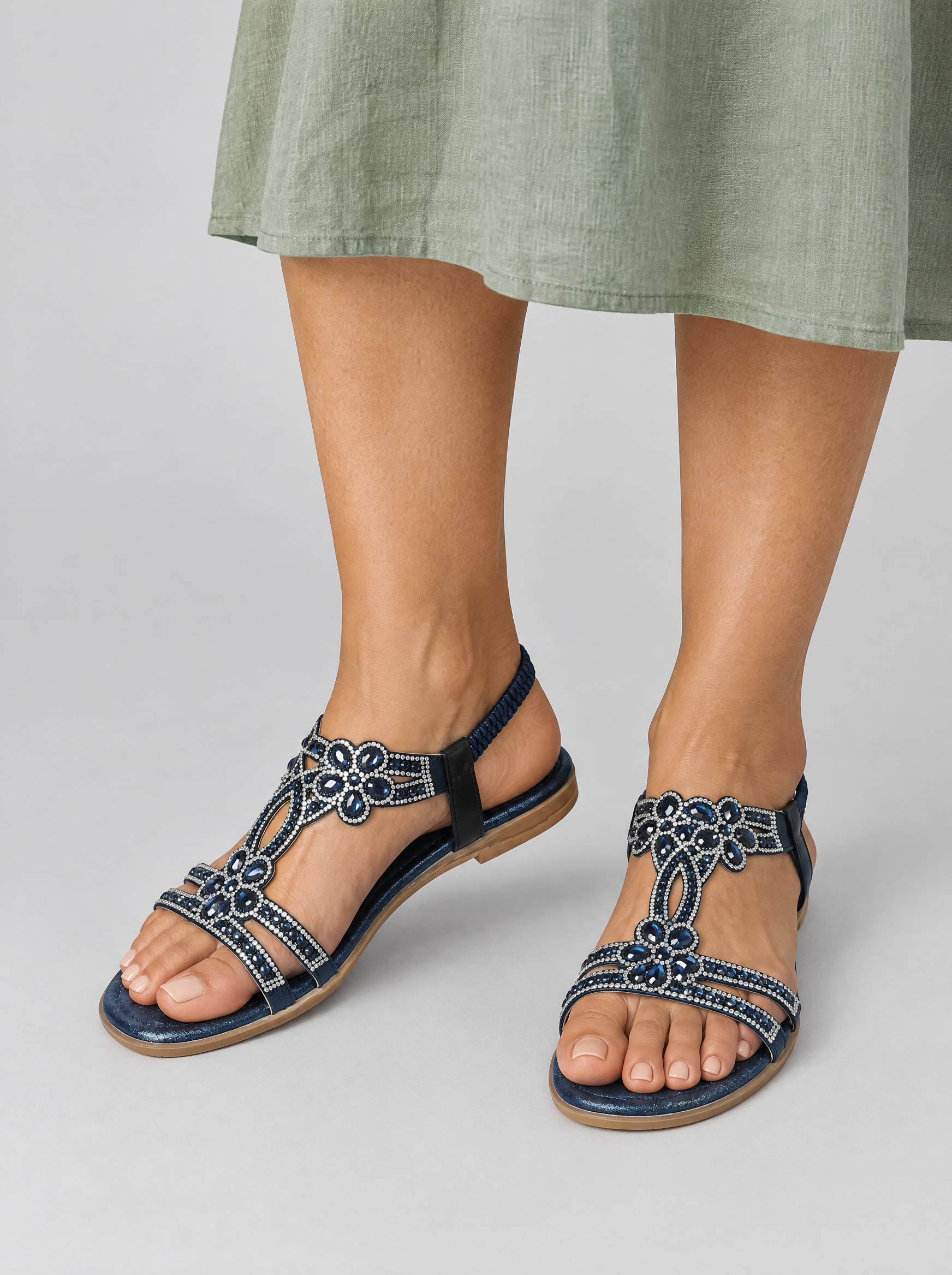 Oona sandals in blue, worn with a soft sage green linen midi dress