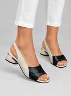 Destiny sandals in black, worn with slim white cropped trousers
