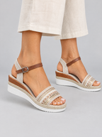 Dacie sandals in natural beige, worn with cream linen culottes