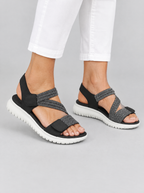 Finley sandals in black, worn with slim white cropped trousers