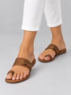 Fernanda sandals in brown, worn with slim white cropped trousers