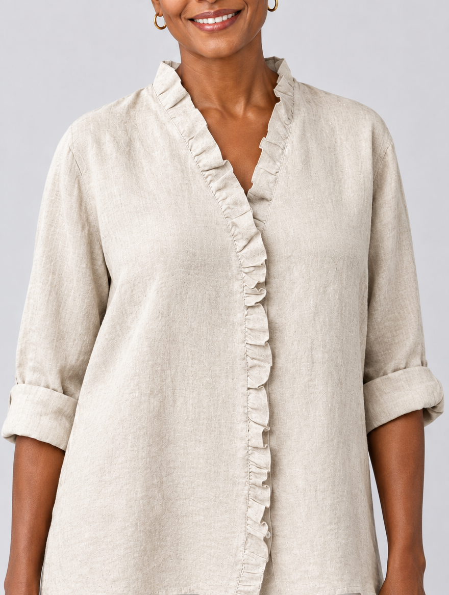 Luisa ruffled linen blouse in beige, close up of ruffle neckline and sleeve